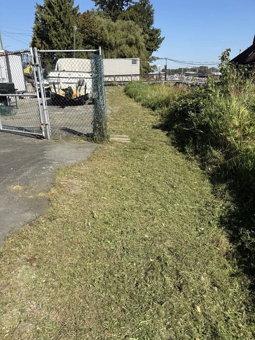 Boatyard weed and walkway cleanup — After